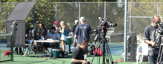 film crew outdoor tennis set